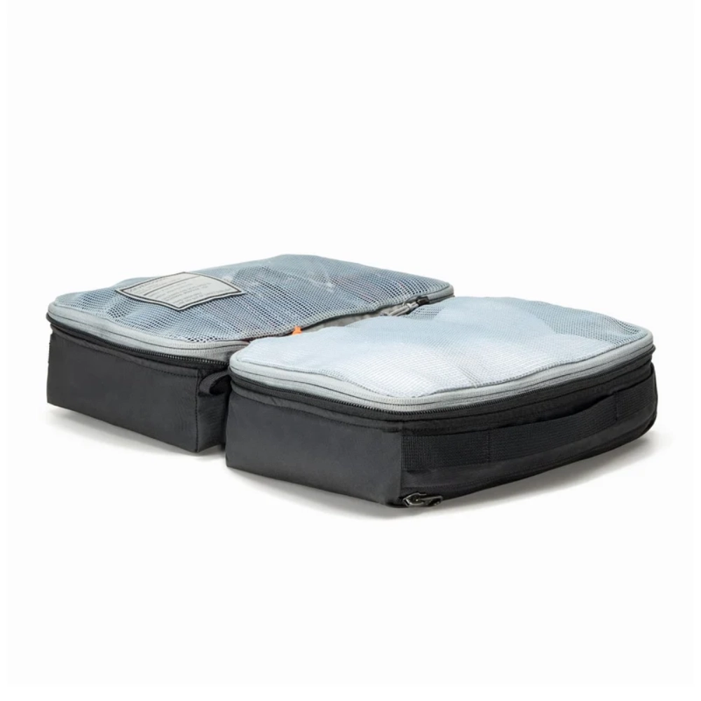 Spessore del packing cube aperto a libro che mostra la struttura simmetrica a due scomparti.